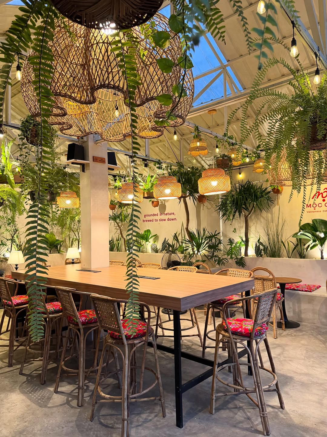 MỘC Cafe seating area with bamboo pendant lights